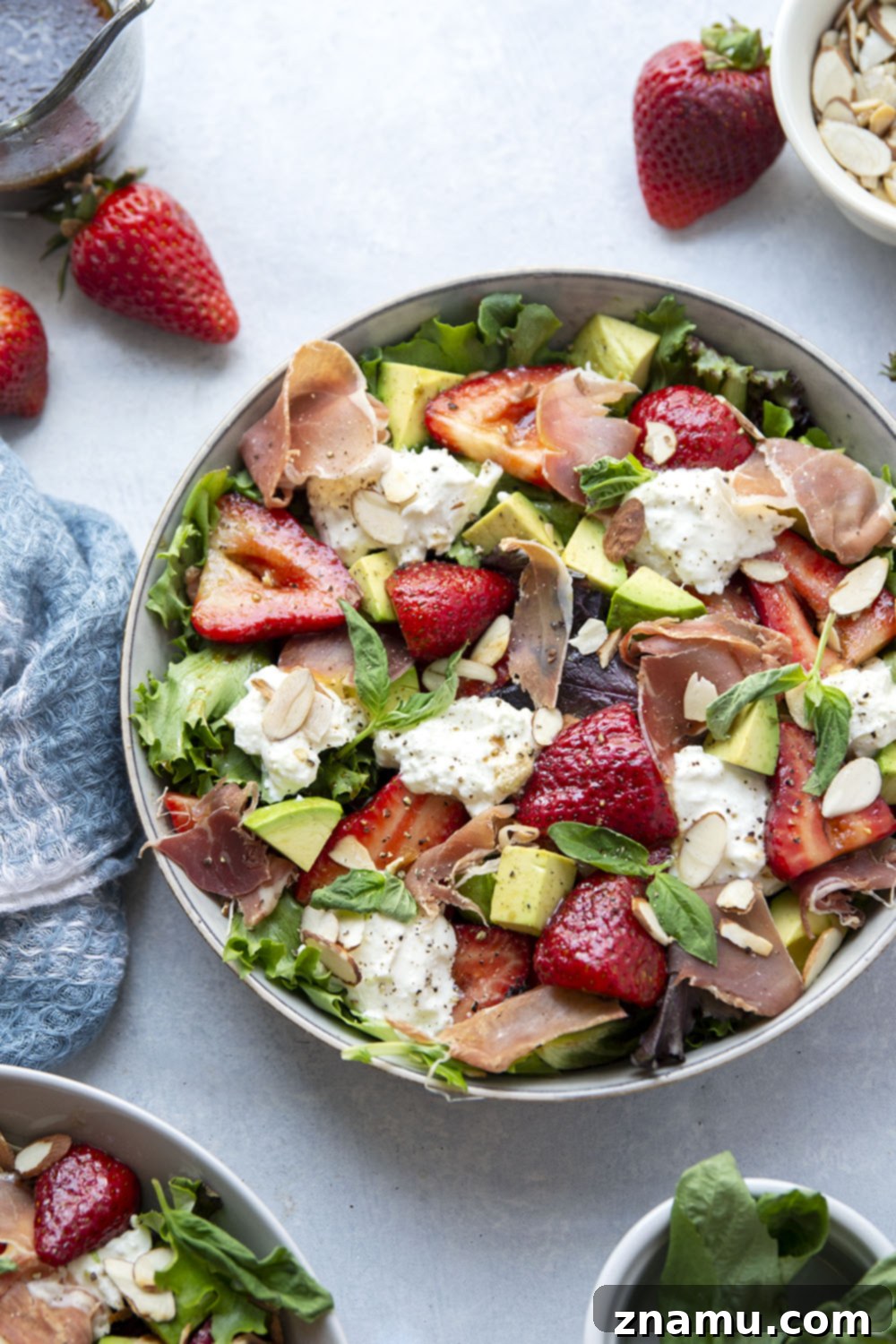 Packed with juicy marinated strawberries, salty prosciutto, and creamy burrata, this strawberry burrata salad is the prettiest summer meal and ready in just minutes!