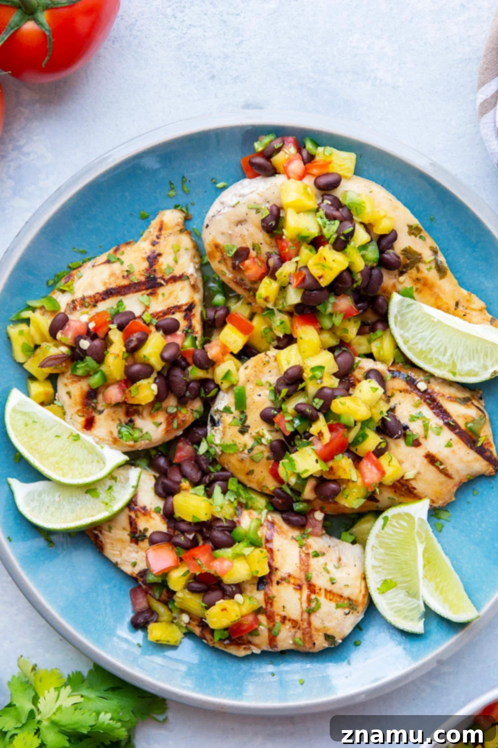 Pineapple Grilled Chicken with Fresh Black Bean Salsa 5 Ingredients for black bean salsa: diced pineapple, black beans, tomato, jalapeño, and cilantro in bowls.
