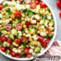 Roasted Garlic Basil Caprese Chickpea Salad 8 This simple chickpea salad features crisp cucumber, juicy cherry tomatoes, fresh mozzarella, and tender chickpeas tossed in an herby roasted garlic basil dressing.
