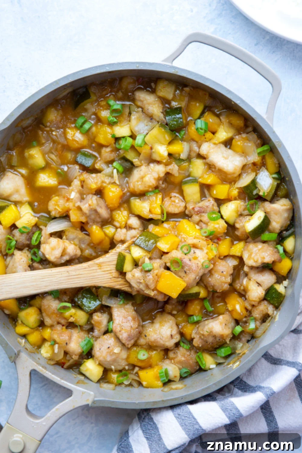Mango Glazed Chicken with Garden Zucchini 2 Loaded with fresh mango and coated in a perfectly sticky sauce, this chicken and zucchini comes together in only one skillet and is fantastic over rice!