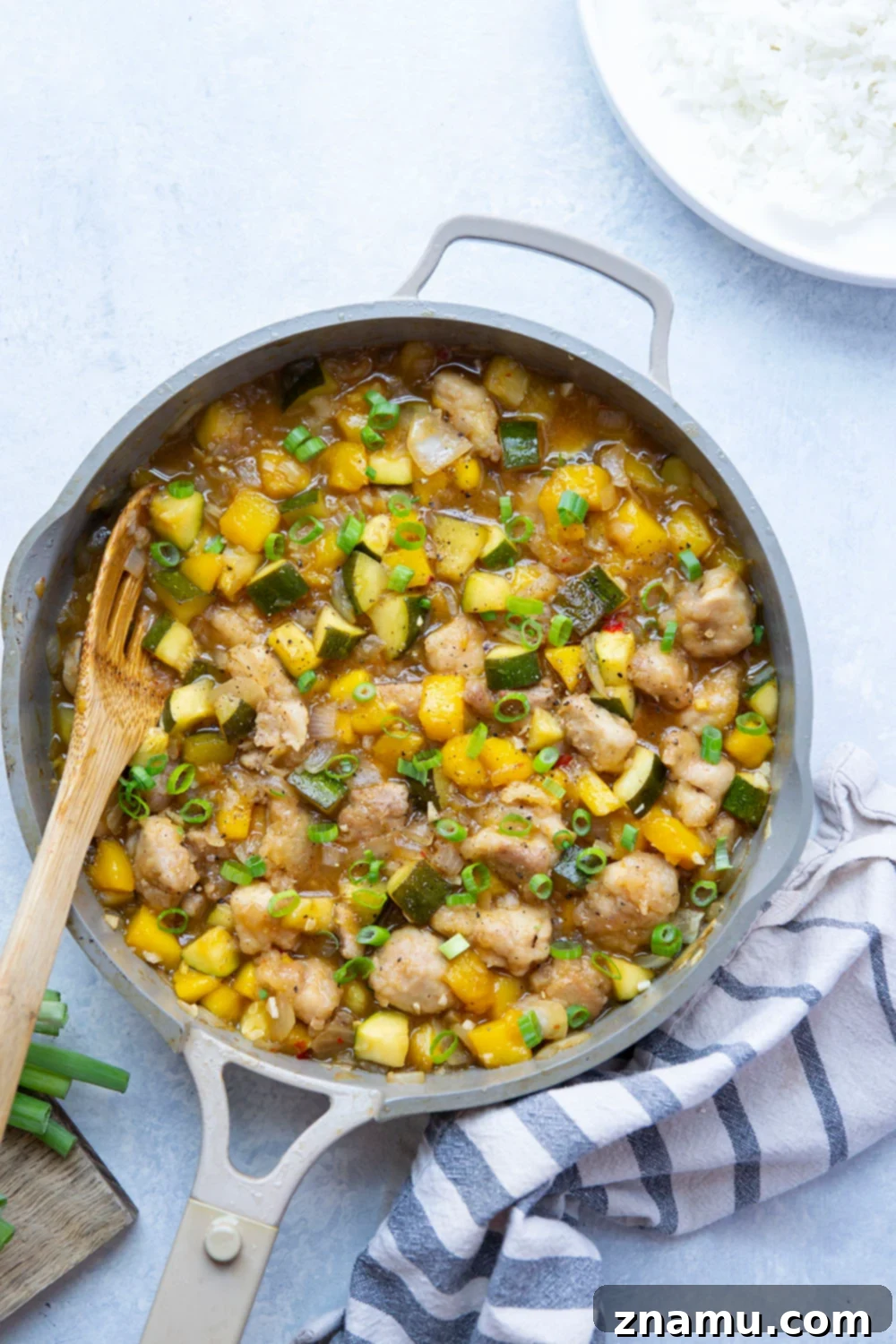 Mango Glazed Chicken with Garden Zucchini 4 Loaded with fresh mango and coated in a perfectly sticky sauce, this chicken and zucchini comes together in only one skillet and is fantastic over rice!