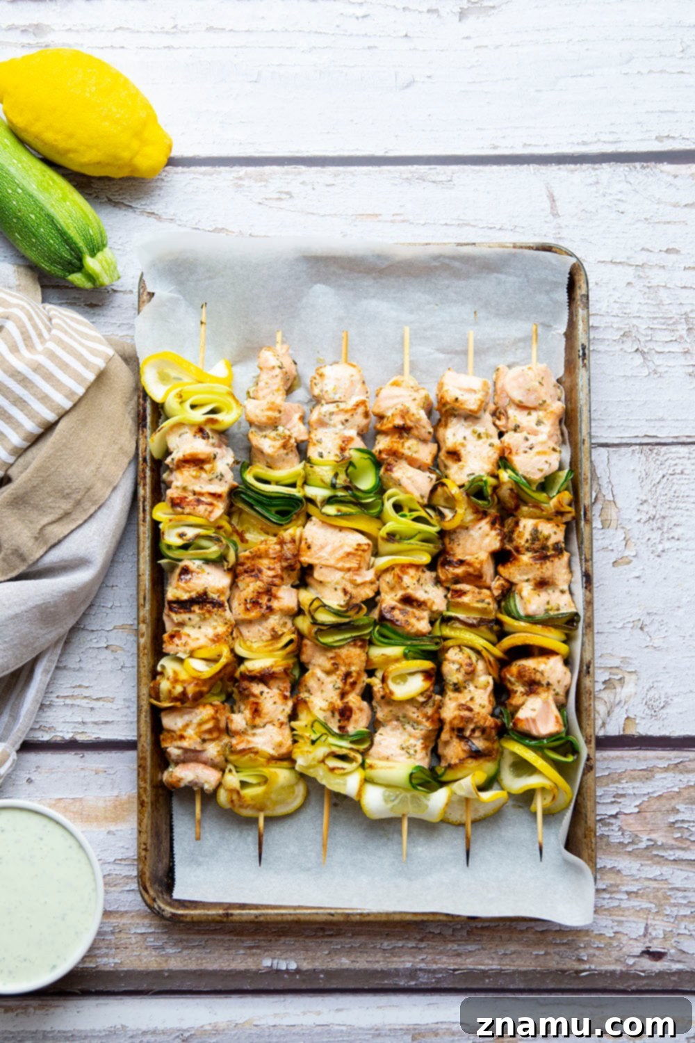 Mediterranean Salmon Skewers with Whipped Feta 3 Close-up of a grilled salmon and zucchini kabob, showing the delicious marinade and sear marks.