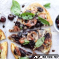 Juicy roasted cherries and salty prosciutto are the ultimate combo in this simple, yet stunning cherry prosciutto flatbread. An easy appetizer for entertaining and so good with summer cherries!