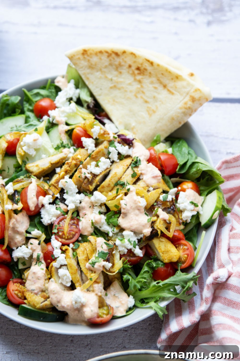 Mediterranean Chicken Shawarma Salad with Smoky Red Pepper Tzatziki 3 Everything you love about a good chicken shawarma is packed into this loaded salad! Juicy marinated chicken thighs and a flavorful roasted red pepper tzatziki take it over the top.