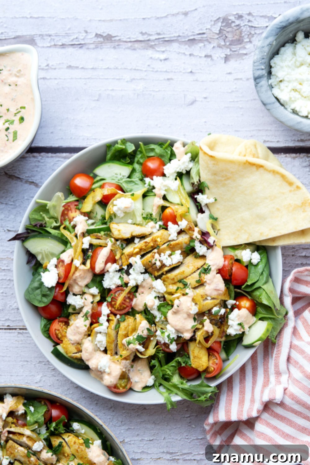 Mediterranean Chicken Shawarma Salad with Smoky Red Pepper Tzatziki 4 Everything you love about a good chicken shawarma is packed into this loaded salad! Juicy marinated chicken thighs and a flavorful roasted red pepper tzatziki take it over the top.