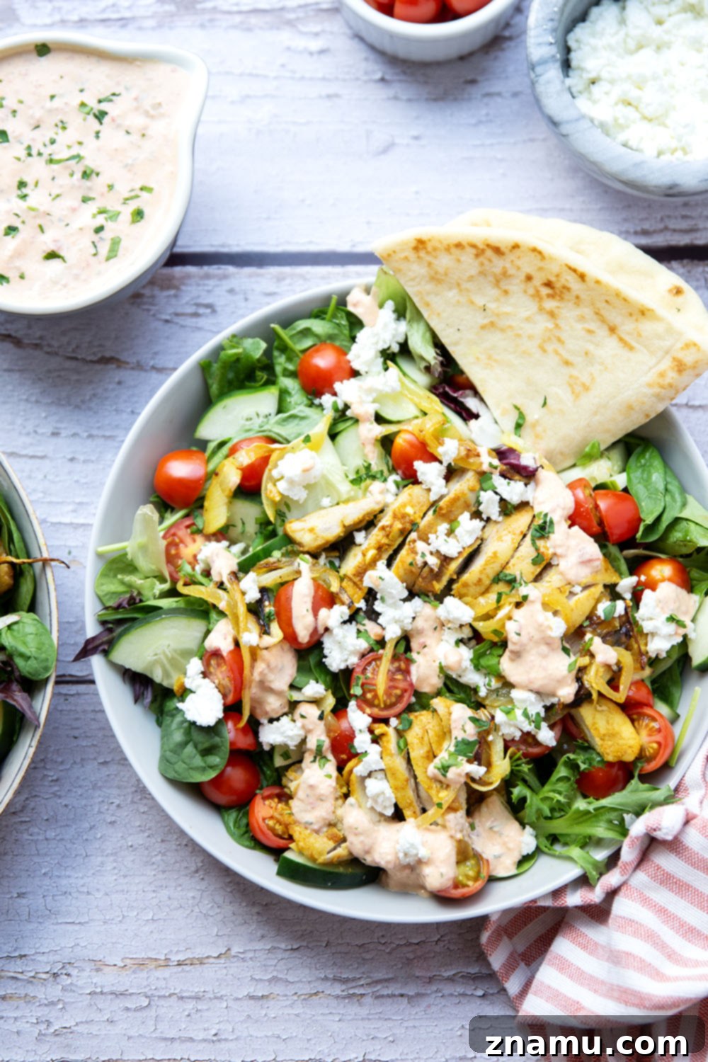 Mediterranean Chicken Shawarma Salad with Smoky Red Pepper Tzatziki 6 Everything you love about a good chicken shawarma is packed into this loaded salad! Juicy marinated chicken thighs and a flavorful roasted red pepper tzatziki take it over the top.