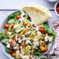 Mediterranean Chicken Shawarma Salad with Smoky Red Pepper Tzatziki 8 Everything you love about a good chicken shawarma is packed into this loaded salad! Juicy marinated chicken thighs and a flavorful roasted red pepper tzatziki take it over the top.
