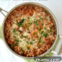 Chili Macaroni and Cheese Skillet 13 Skillet Chili Macaroni & Cheese with ground beef, tomatoes, and cheddar cheese