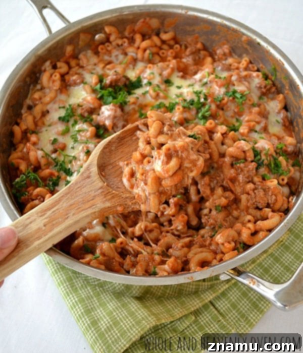 Chili Macaroni and Cheese Skillet 6 Golden brown cheddar cheese melting on Skillet Chili Macaroni & Cheese