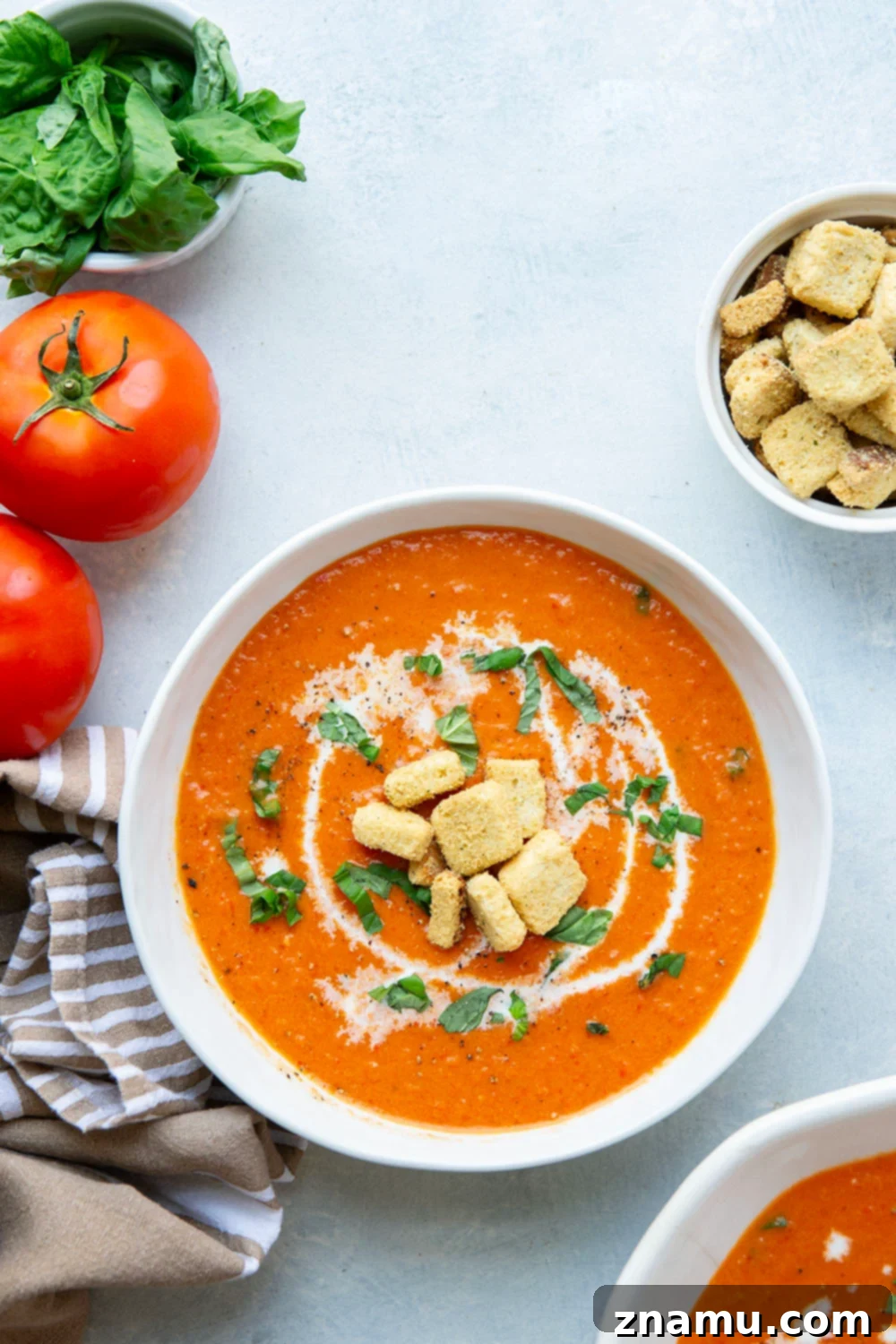 Crimson Fire-Roasted Tomato & Pepper Bisque 4 Fresh, ripe tomatoes and sweet red peppers laid out before roasting, highlighting the quality produce used in the soup.