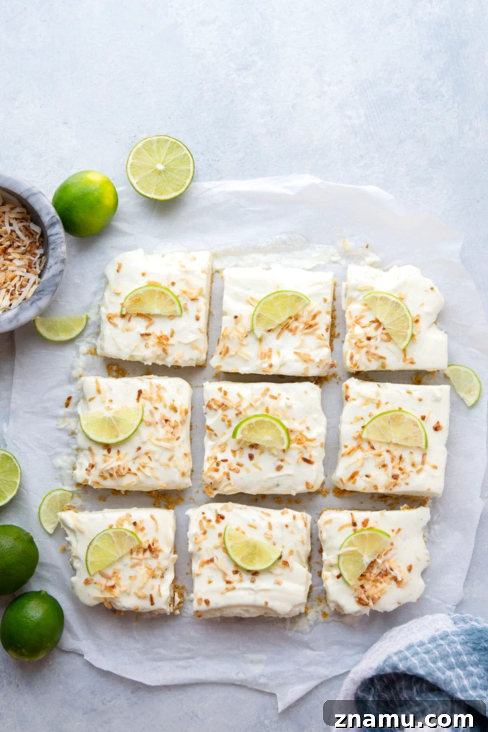 Coconut Key Lime Dream Bars 3 Close-up of a Coconut Key Lime Cheesecake Bar showing the creamy filling, crumbly crust, and abundant toasted coconut.