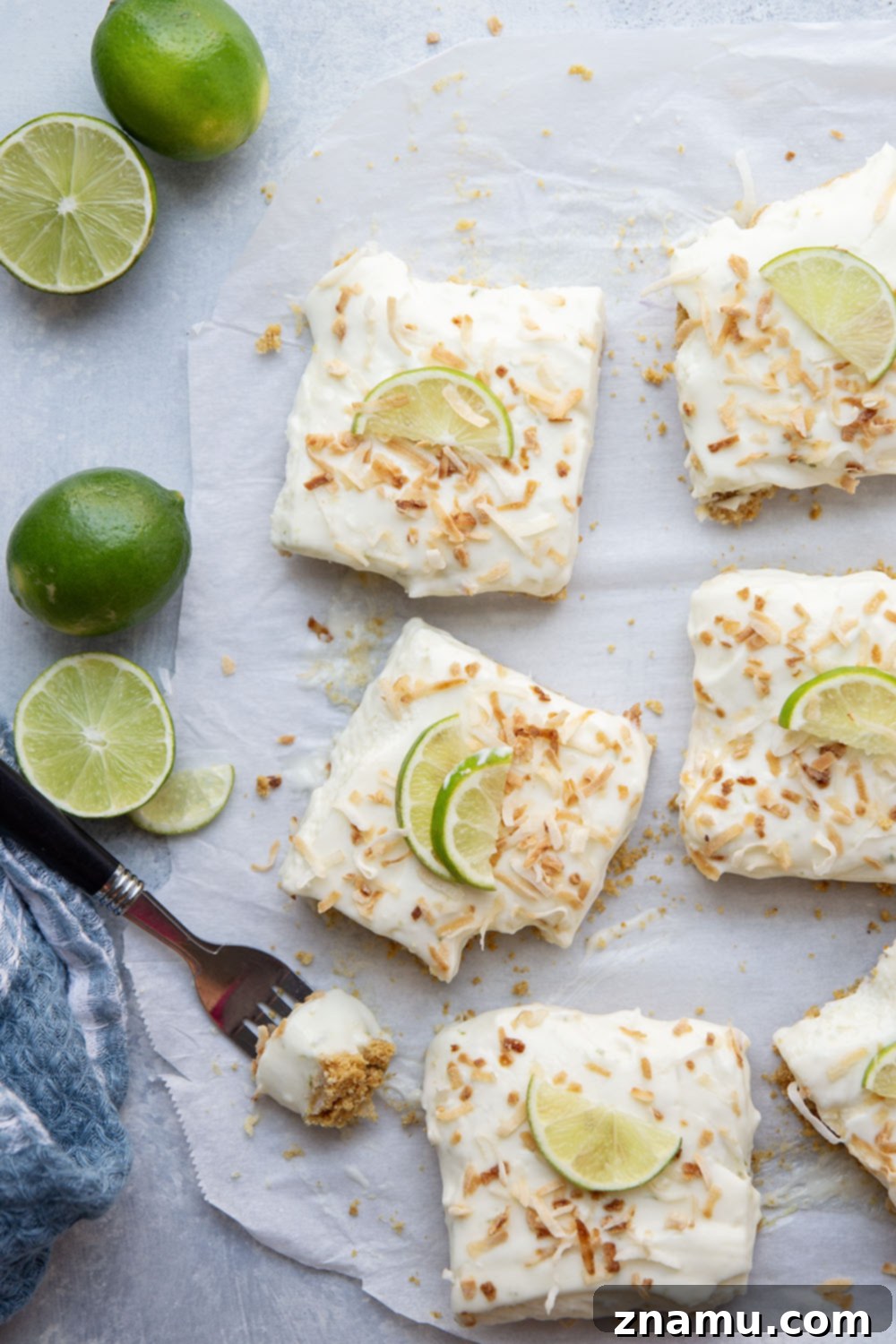 Coconut Key Lime Dream Bars 6 Several Coconut Key Lime Cheesecake Bars ready to be served, topped with toasted coconut.