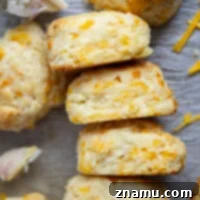These roasted garlic cheddar biscuits have a lovely roasted garlic flavor and lots of gooey cheddar cheese. Ready in minutes and so light and flaky!