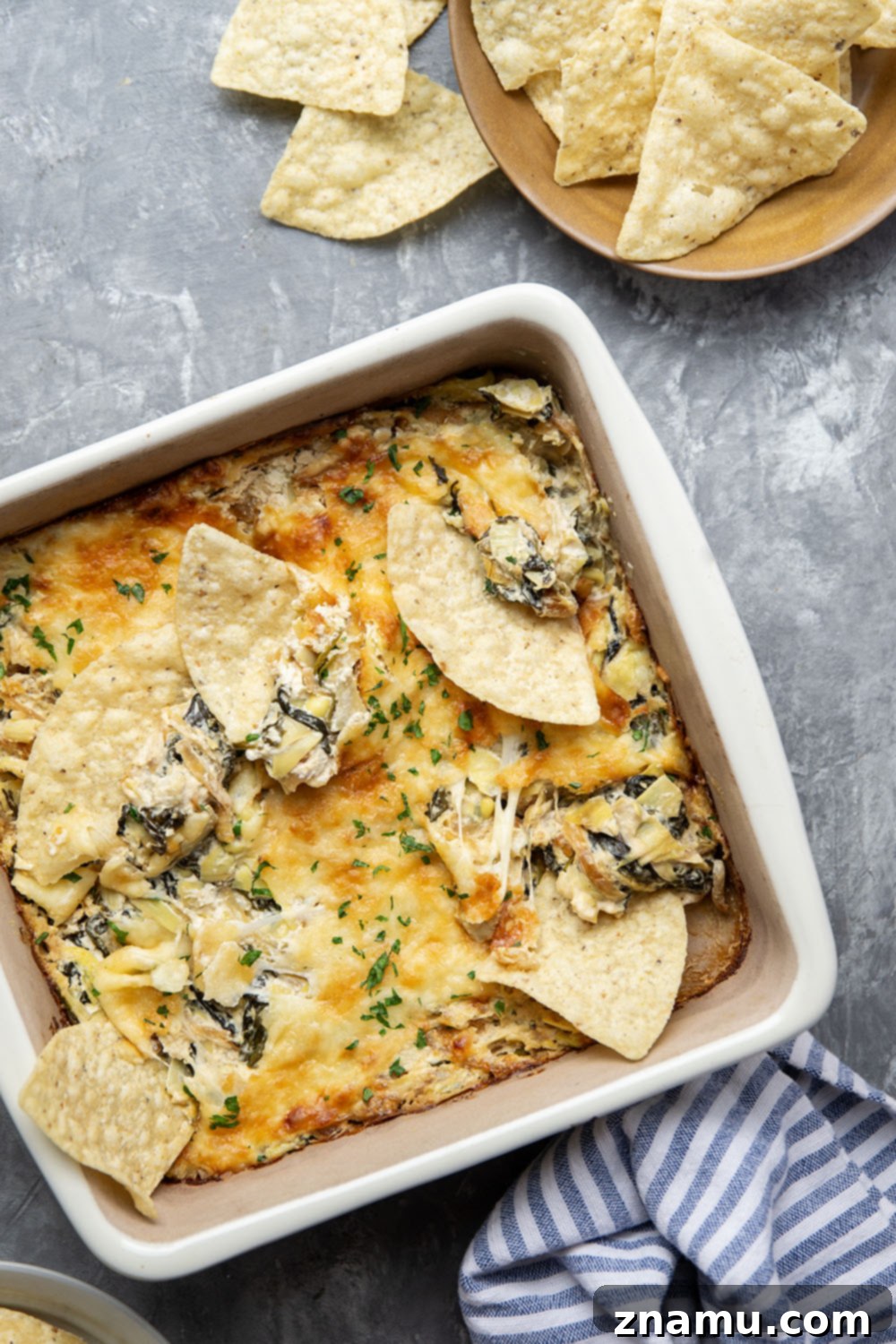 Sweet Caramelized Onion & Spinach Artichoke Bake 6 Caramelized onion spinach artichoke dip bubbling hot from the oven.