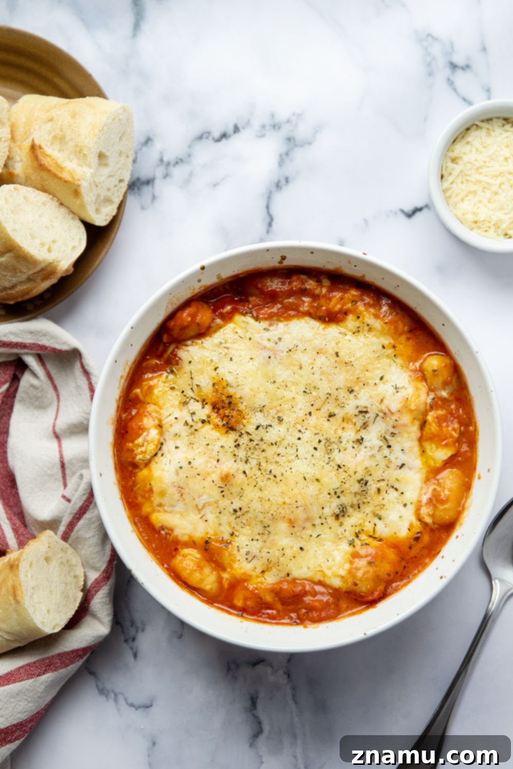 Golden Baked Gnocchi alla Vodka 3 Baked in layers of homemade tomato vodka sauce and 3 kinds of cheese, this baked gnocchi alla vodka is an easy weeknight dinner and so amazing with fresh bread for dipping!
