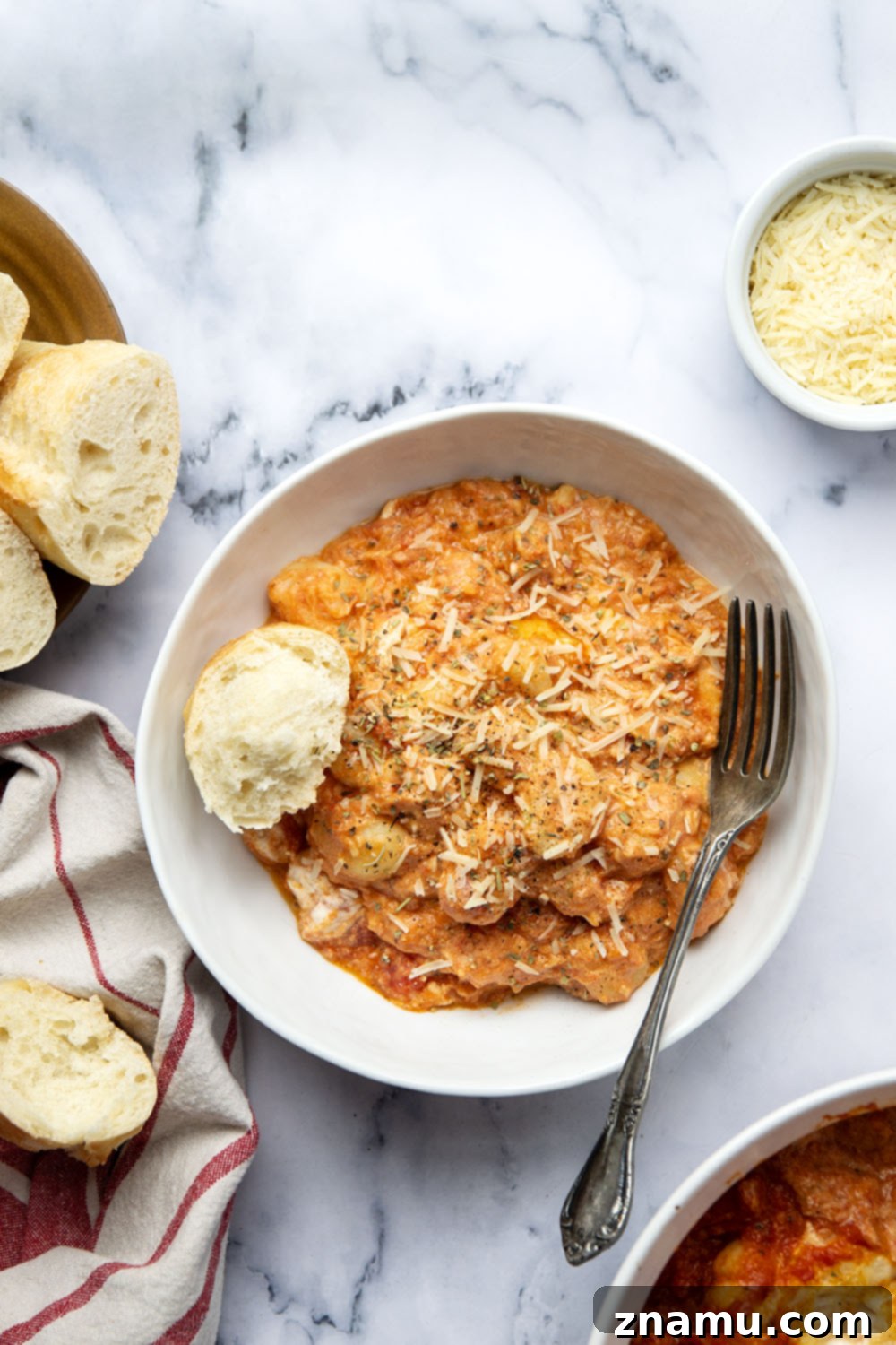 Golden Baked Gnocchi alla Vodka 4 Baked in layers of homemade tomato vodka sauce and 3 kinds of cheese, this baked gnocchi alla vodka is an easy weeknight dinner and so amazing with fresh bread for dipping!
