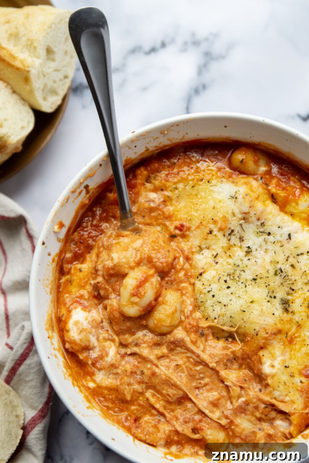 Golden Baked Gnocchi alla Vodka 5 Baked in layers of homemade tomato vodka sauce and 3 kinds of cheese, this baked gnocchi alla vodka is an easy weeknight dinner and so amazing with fresh bread for dipping!