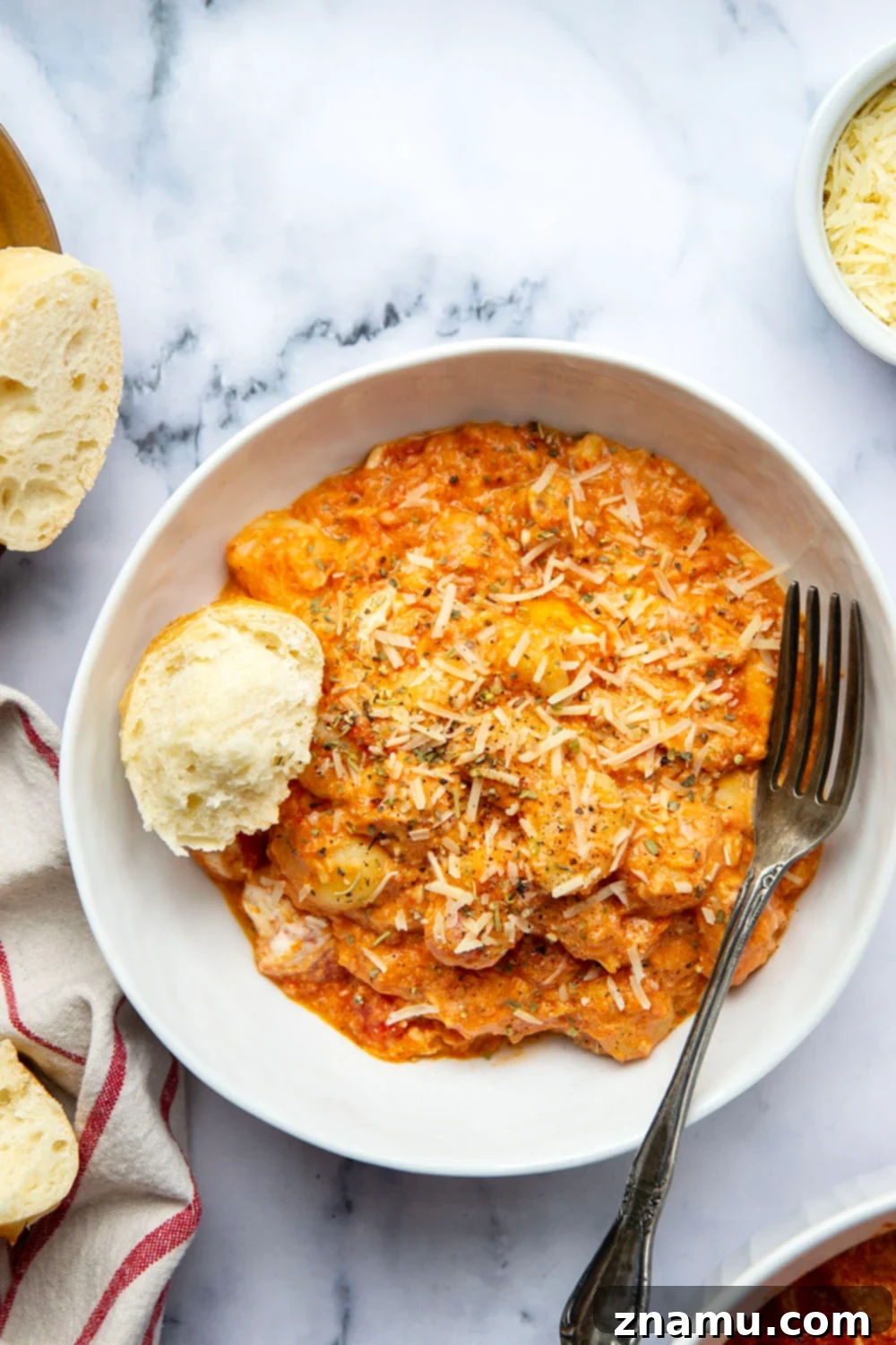 Golden Baked Gnocchi alla Vodka 6 Baked in layers of homemade tomato vodka sauce and 3 kinds of cheese, this baked gnocchi alla vodka is an easy weeknight dinner and so amazing with fresh bread for dipping!