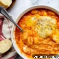 Golden Baked Gnocchi alla Vodka 8 Baked in layers of homemade tomato vodka sauce and 3 kinds of cheese, this baked gnocchi alla vodka is an easy weeknight dinner and so amazing with fresh bread for dipping!