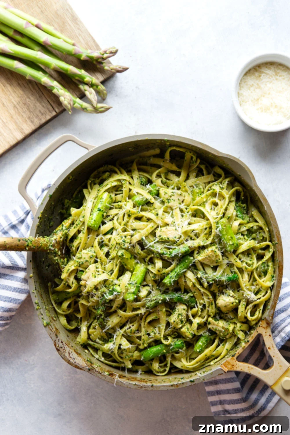 Vibrant Chicken Asparagus Pesto Pasta 3 This chicken asparagus pesto pasta features tender fettuccine pasta tossed with sautéed chicken, asparagus, and lots of flavorful pesto.