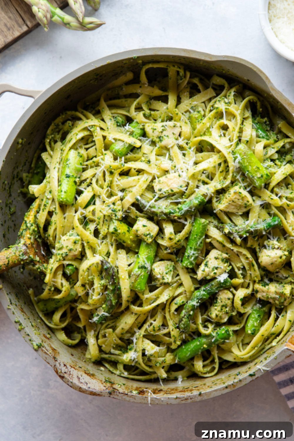 Vibrant Chicken Asparagus Pesto Pasta 4 This chicken asparagus pesto pasta features tender fettuccine pasta tossed with sautéed chicken, asparagus, and lots of flavorful pesto.
