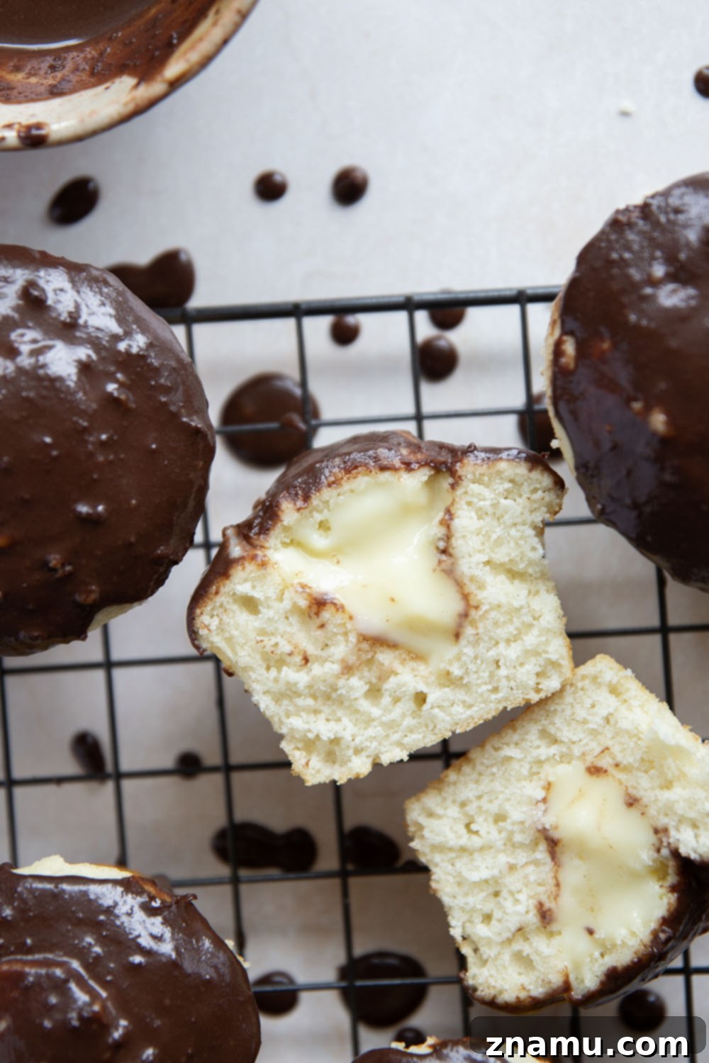 Classic Boston Cream Pie Cupcakes 6 These Boston cream pie cupcakes feature soft and buttery white cupcakes filled with vanilla pastry cream and topped with rich chocolate ganache.