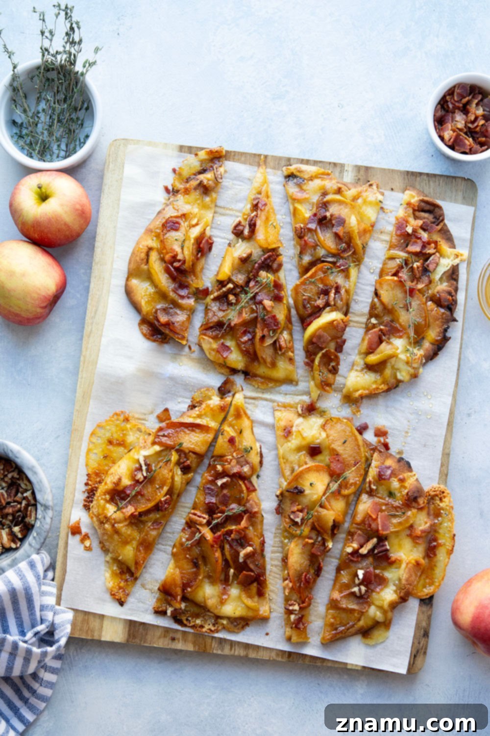 Gourmet Caramelized Apple Brie Flatbread 6 Caramelized apple brie flatbread freshly out of the oven, topped with bacon, pecans, and a honey drizzle.