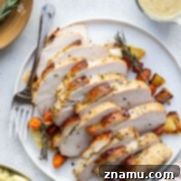 This dry brined turkey breast is incredibly tender and juicy from a flavorful dry brine and the perfect way to serve turkey for a smaller crowd! Serve with your favorite side dishes and lots of flavorful apple cider gravy on top.