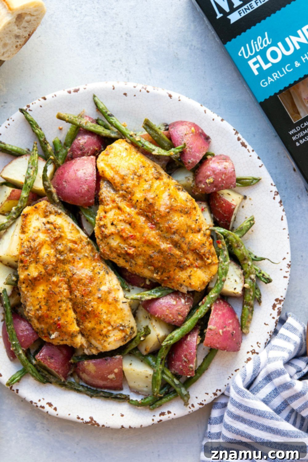 Garlic Herb Baked Flounder and Roasted Red Potatoes 6 Flavorful garlic herb baked flounder, tender roasted red potatoes and green beans are the perfect trio in this fast and flavorful sheet pan dinner!