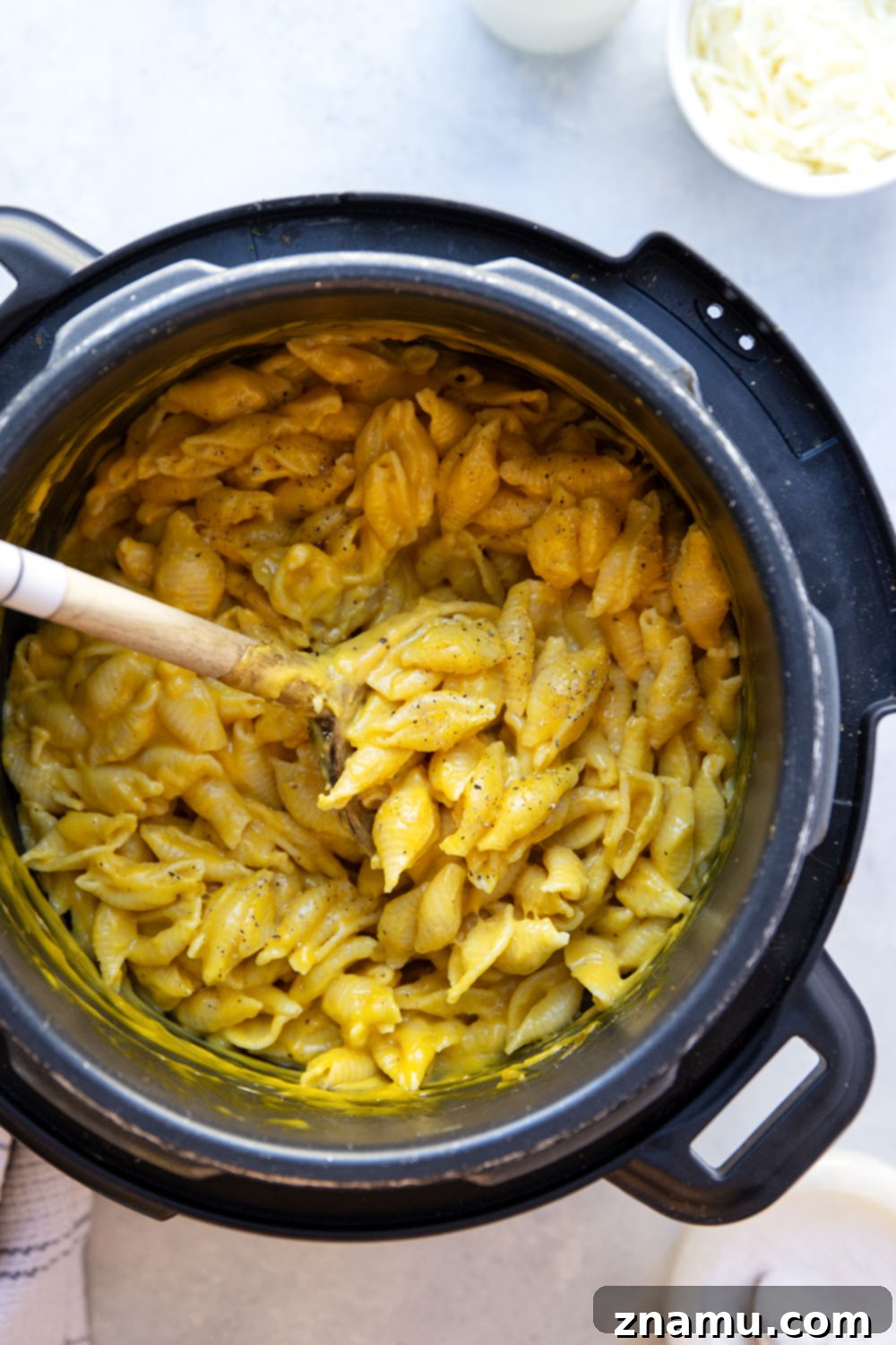 Velvety Instant Pot Butternut Squash Mac and Cheese 6 Instant Pot Butternut Squash Mac and Cheese served in a rustic bowl