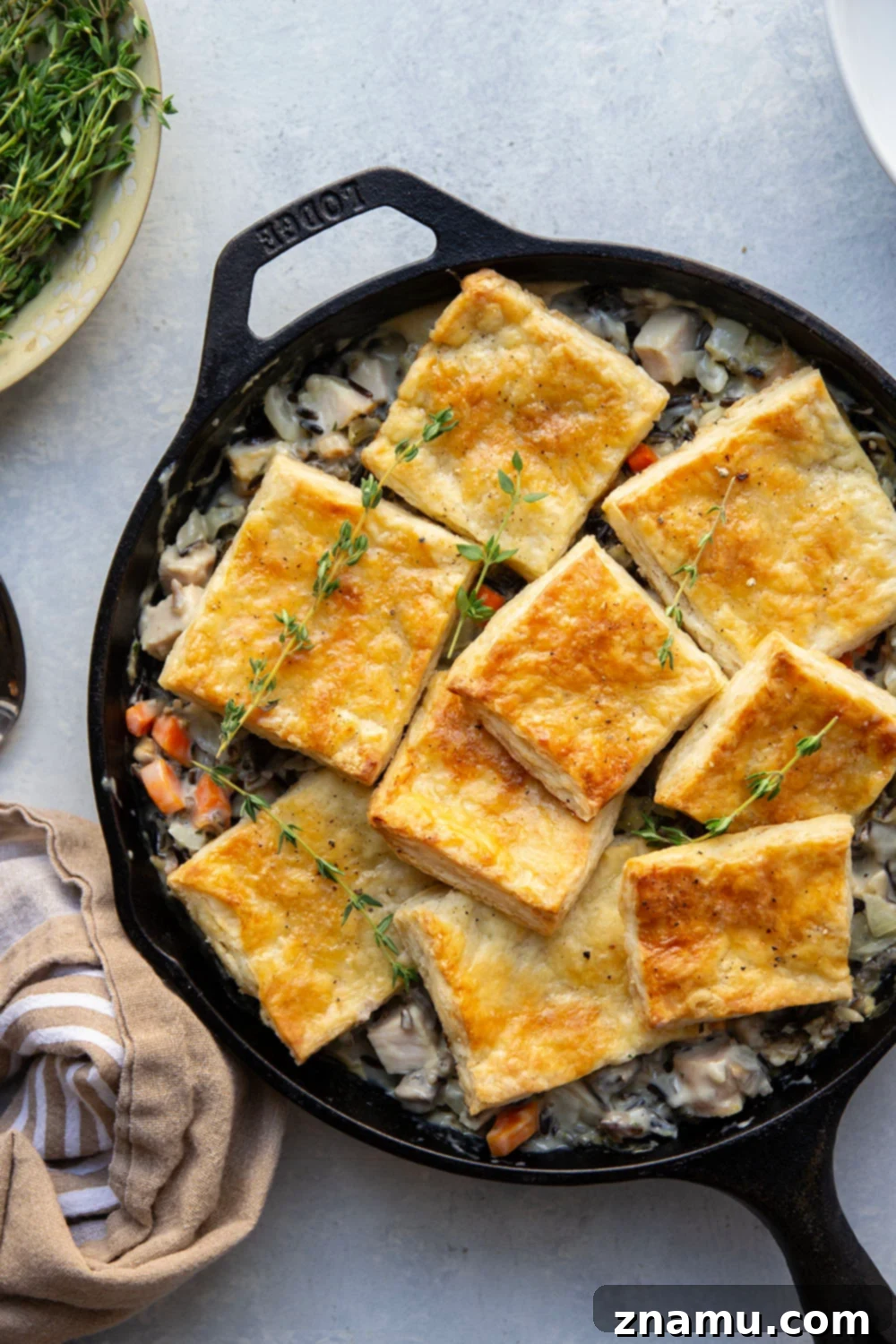 Hearty Turkey Wild Rice Pot Pie 2 This turkey wild rice pot pie features a creamy filling of wild rice and turkey with flaky homemade pastry squares baked on top. It's the perfect use for leftover turkey!