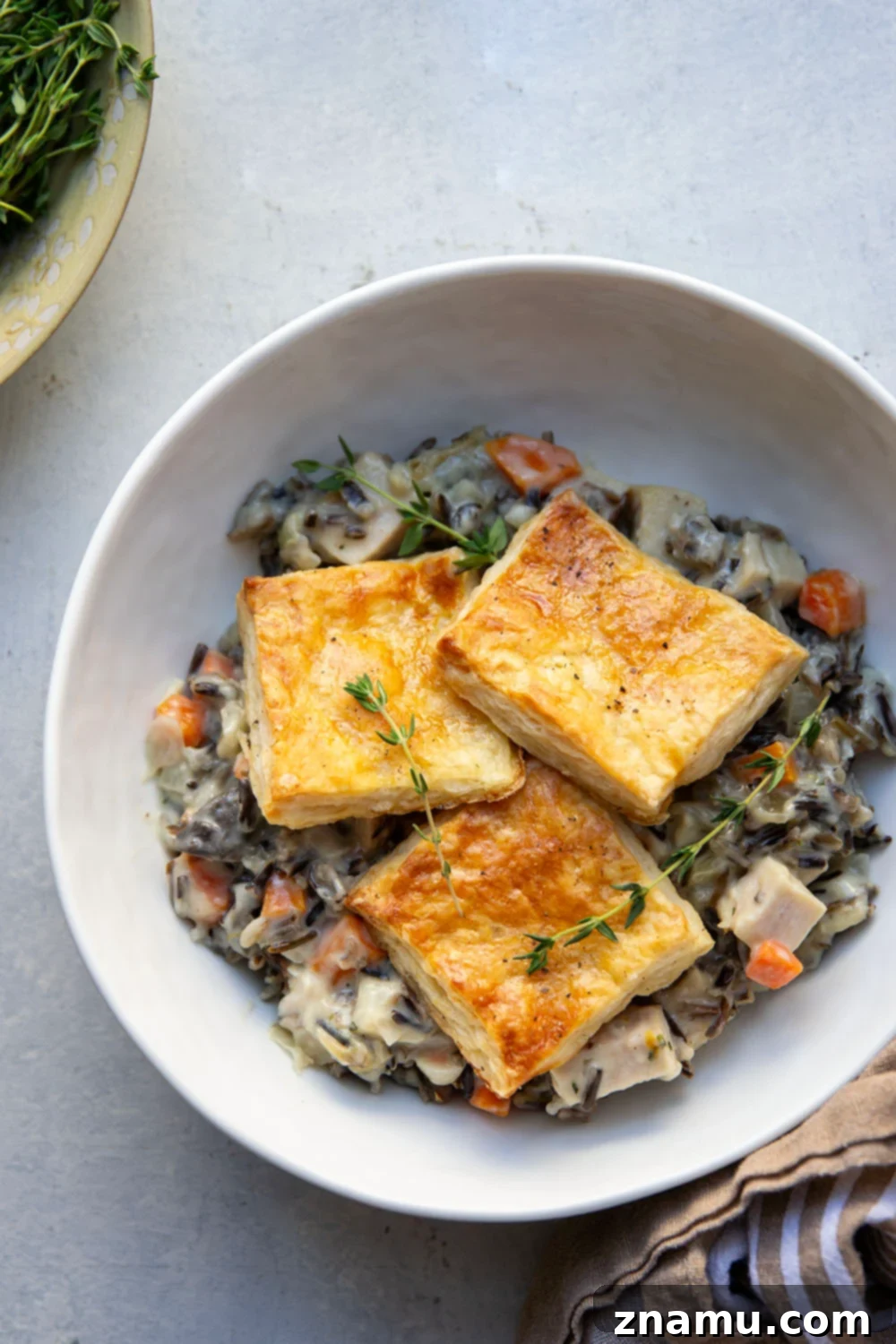Hearty Turkey Wild Rice Pot Pie 5 This turkey wild rice pot pie features a creamy filling of wild rice and turkey with flaky homemade pastry squares baked on top. It's the perfect use for leftover turkey!