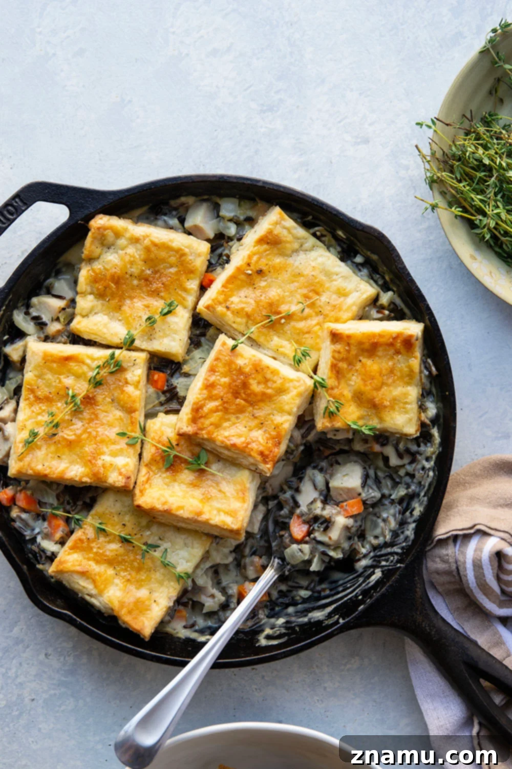 Hearty Turkey Wild Rice Pot Pie 6 This turkey wild rice pot pie features a creamy filling of wild rice and turkey with flaky homemade pastry squares baked on top. It's the perfect use for leftover turkey!