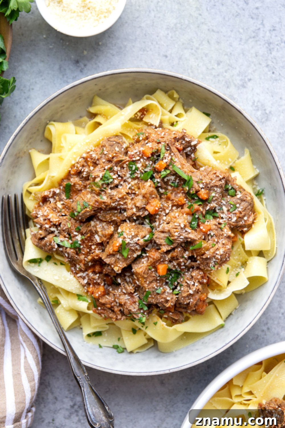 Rustic Slow Cooked Beef Ragu 2 Slow cooked to perfect fall-apart tender perfection and loaded with hearty flavors, this slow cooker beef ragu is incredible over warm pappardelle pasta and a comfort food favorite!