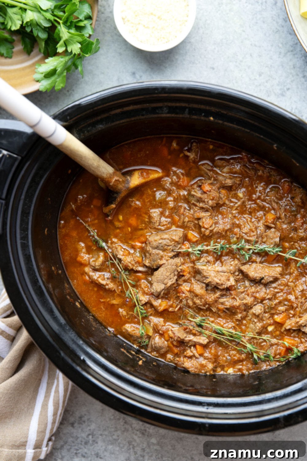 Rustic Slow Cooked Beef Ragu 3 Slow cooked to perfect fall-apart tender perfection and loaded with hearty flavors, this slow cooker beef ragu is incredible over warm pappardelle pasta and a comfort food favorite!