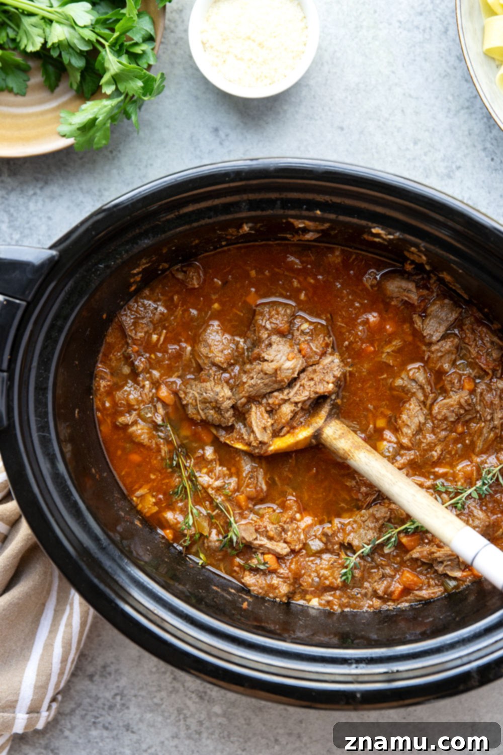Rustic Slow Cooked Beef Ragu 5 Slow cooked to perfect fall-apart tender perfection and loaded with hearty flavors, this slow cooker beef ragu is incredible over warm pappardelle pasta and a comfort food favorite!