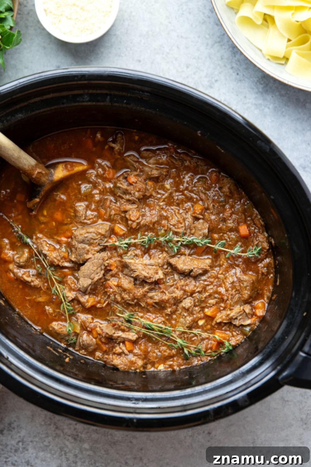 Rustic Slow Cooked Beef Ragu 6 Slow cooked to perfect fall-apart tender perfection and loaded with hearty flavors, this slow cooker beef ragu is incredible over warm pappardelle pasta and a comfort food favorite!