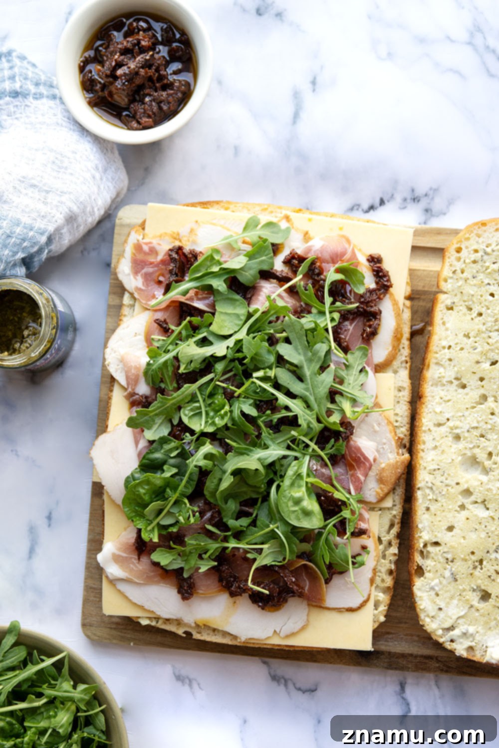 Sun-Dried Tomato & Turkey Focaccia 3 Layers of roast turkey, cheese, and flavorful sun-dried tomatoes star in this turkey focaccia sandwich that's so easy to whip up and perfect for leftover turkey!