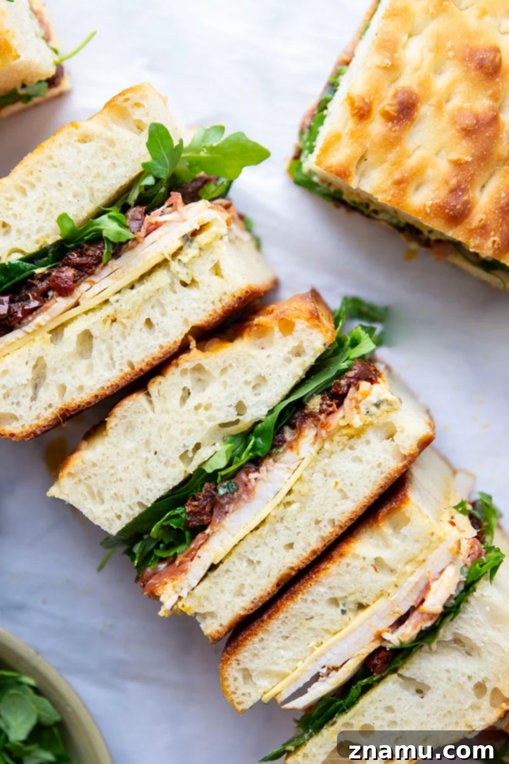 Sun-Dried Tomato & Turkey Focaccia 5 Layers of roast turkey, cheese, and flavorful sun-dried tomatoes star in this turkey focaccia sandwich that's so easy to whip up and perfect for leftover turkey!