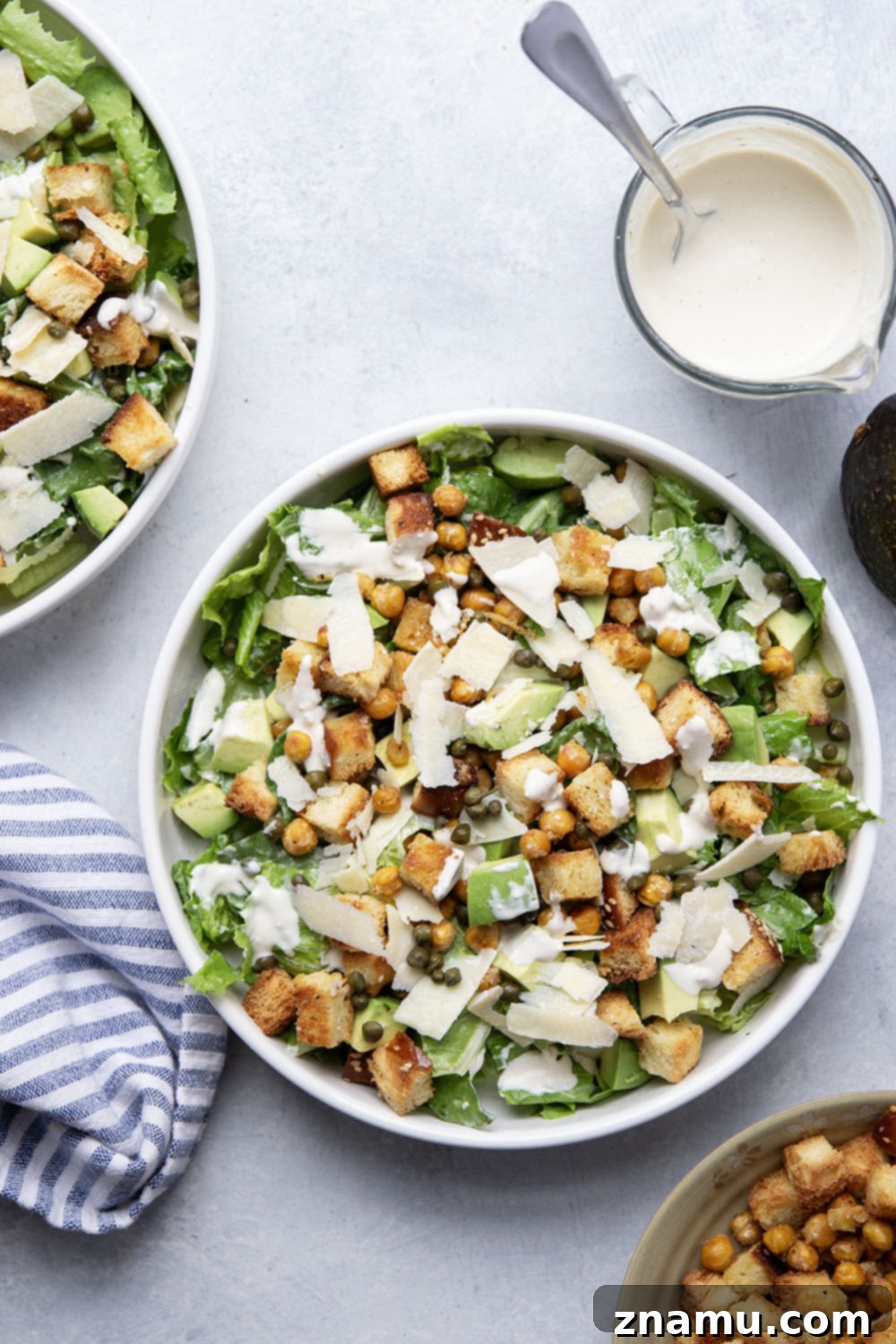 Crispy Chickpea & Creamy Avocado Caesar 2 Loaded with silky avocado, sharp Parmesan, and crispy chickpeas and croutons, this chickpea caesar salad is a delicious twist on the classic and goes well with so many meals!