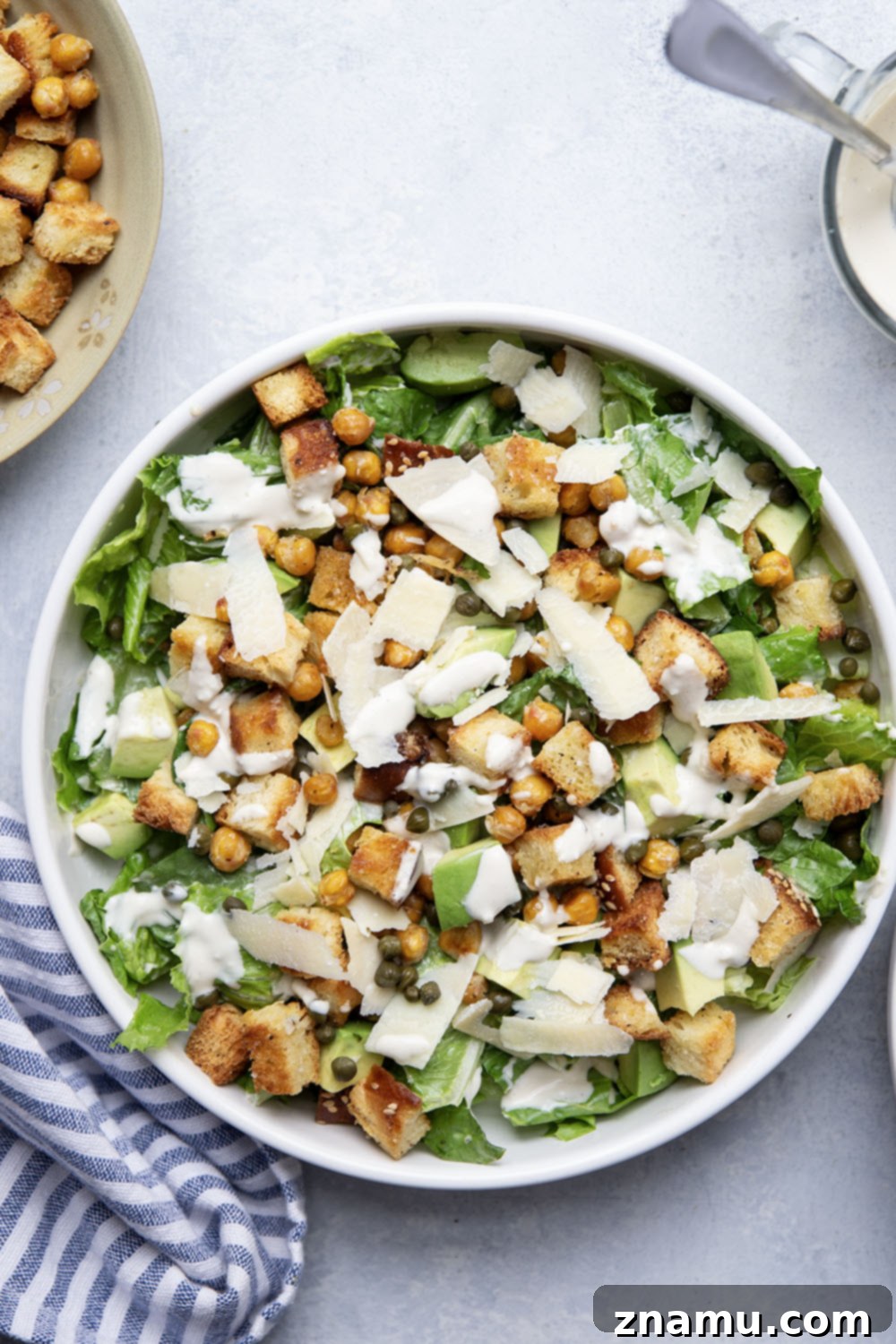 Crispy Chickpea & Creamy Avocado Caesar 5 Loaded with silky avocado, sharp Parmesan, and crispy chickpeas and croutons, this chickpea caesar salad is a delicious twist on the classic and goes well with so many meals!