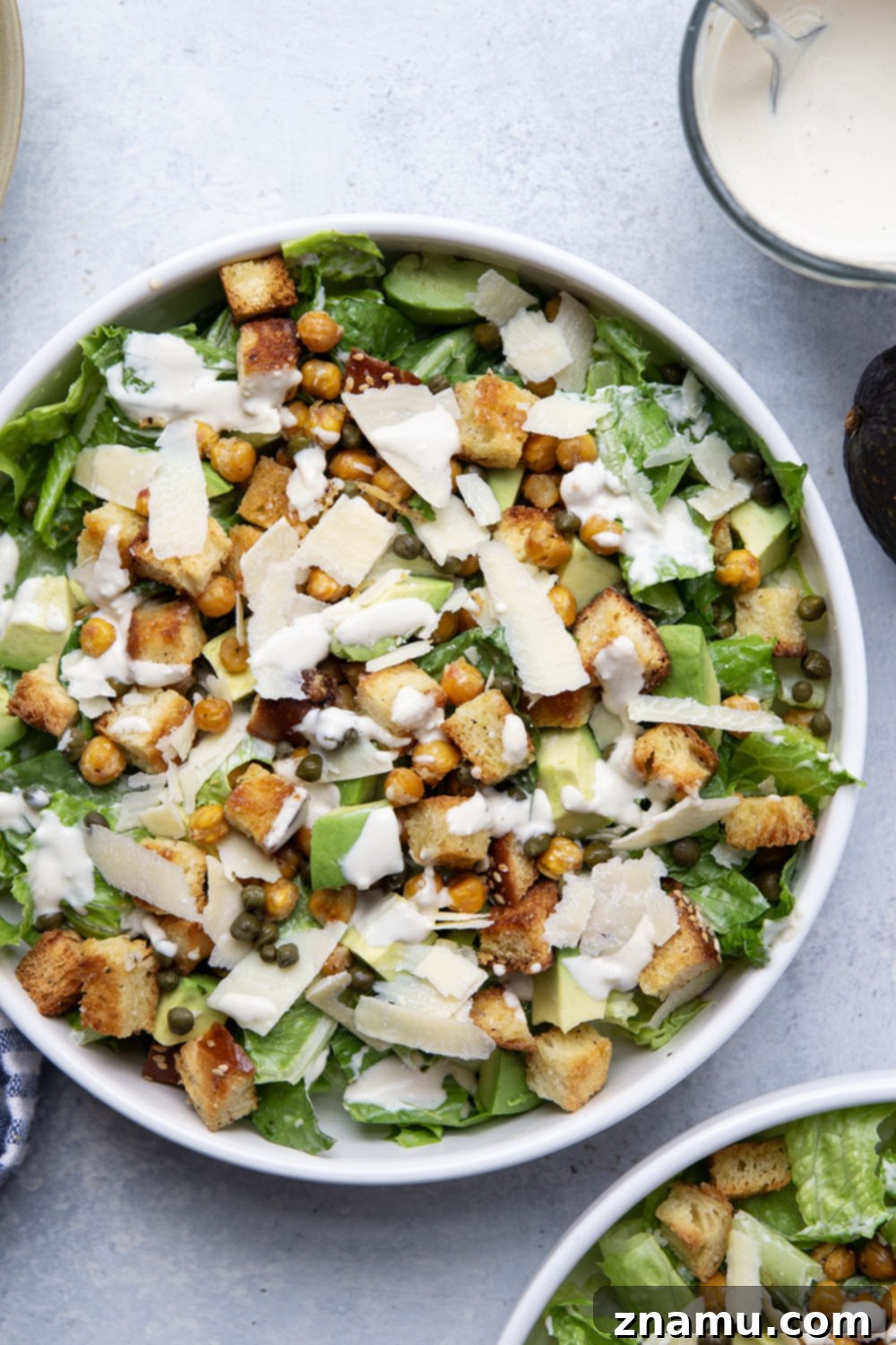Crispy Chickpea & Creamy Avocado Caesar 6 Loaded with silky avocado, sharp Parmesan, and crispy chickpeas and croutons, this chickpea caesar salad is a delicious twist on the classic and goes well with so many meals!