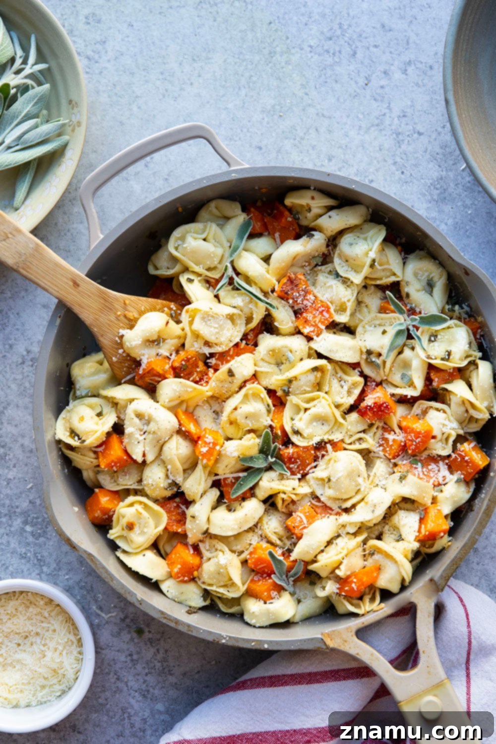 Butternut squash and tortellini dish, showcasing the golden roasted squash cubes and soft tortellini.