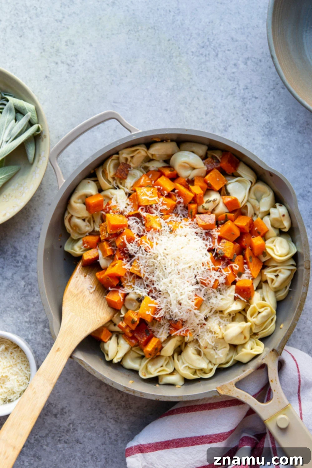 The finished butternut squash and tortellini dish, ready to be served, highlighting the delicious sauce.