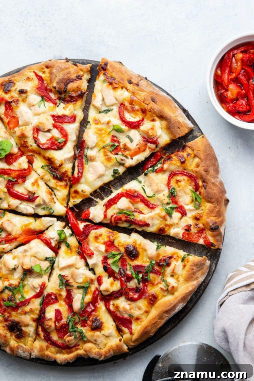Roasted Red Pepper & Chicken Alfredo Pizza 2 Creamy homemade alfredo sauce, juicy chicken cubes, and flavorful roasted red peppers are the perfect trio in this alfredo roasted red pepper pizza! Top slices with lots of fresh basil for extra flavor.