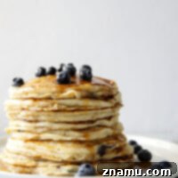 Pillowy Blueberry Ricotta Pancakes 8 Ricotta cheese makes these blueberry ricotta pancakes unbelievably melt-in-your mouth light and fluffy. Better than your favorite brunch place and so easy to make at home!