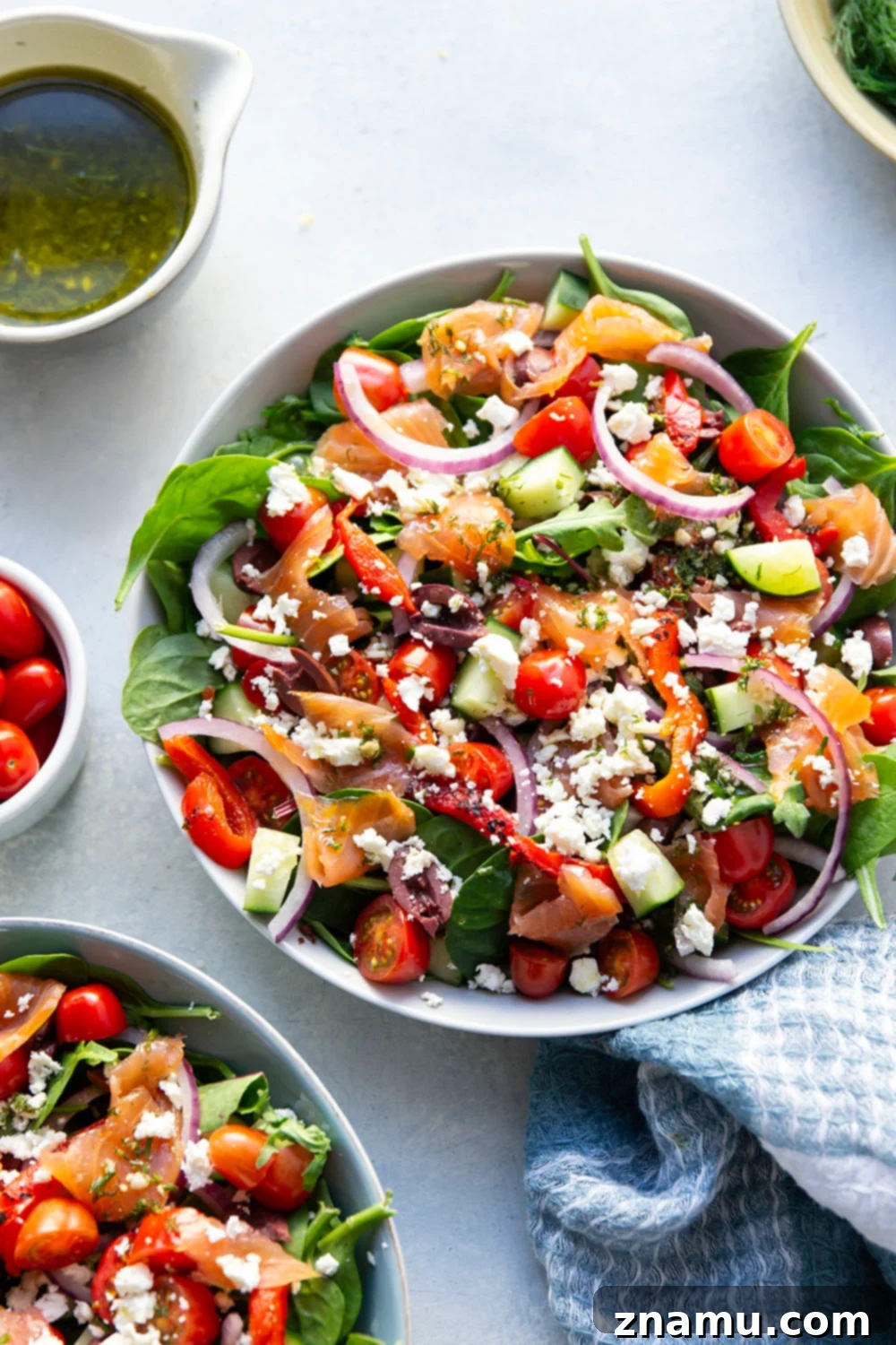 Mediterranean Smoked Salmon Salad 3 This smoked salmon Greek salad is a twist on the classic and features flavorful smoked salmon with a tangy lemon dill vinaigrette tossed with greens and lots of Greek ingredients.
