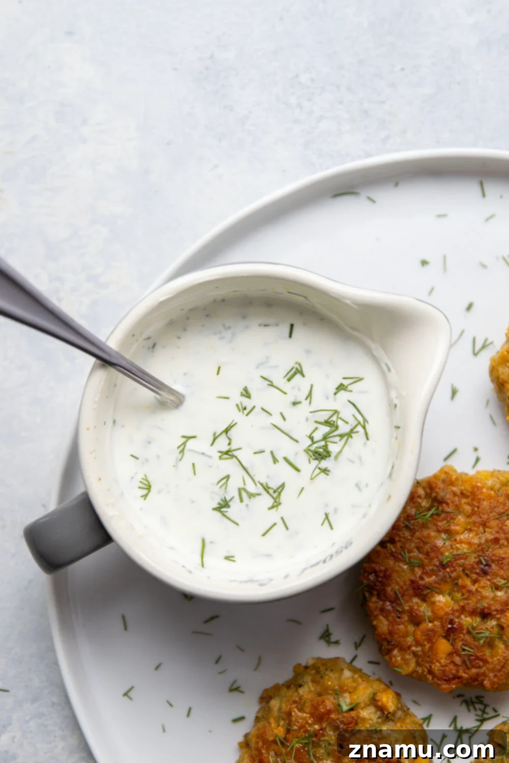 Zesty Lemon Dill Chickpea Fritters 4 These chickpea fritters are perfectly crispy and pair incredibly well with a tangy fresh lemon dill sauce for dipping!