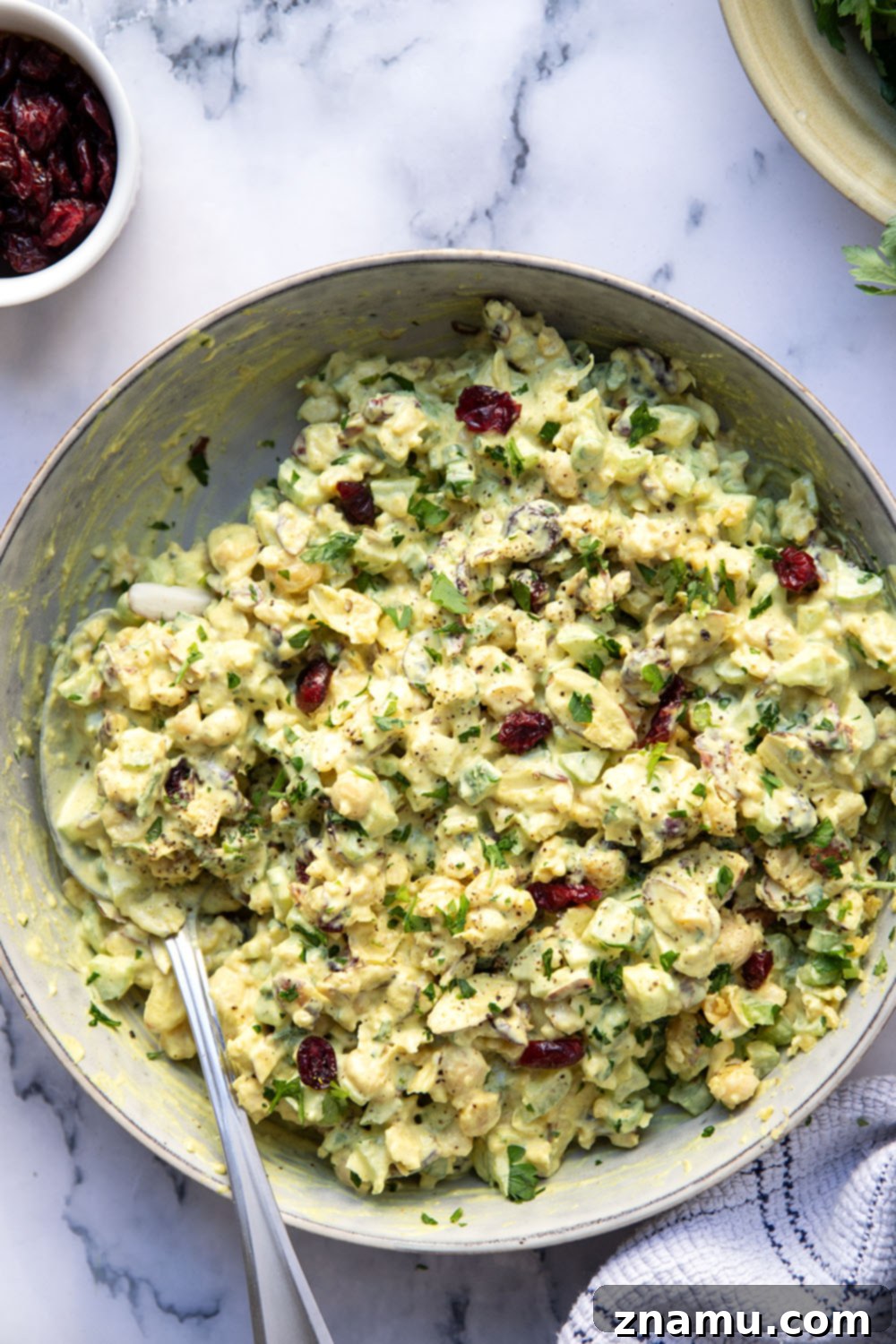 Sunshine Curried Chickpea Salad 6 A serving suggestion of curried chickpea salad in a sandwich, showcasing its delicious appeal.