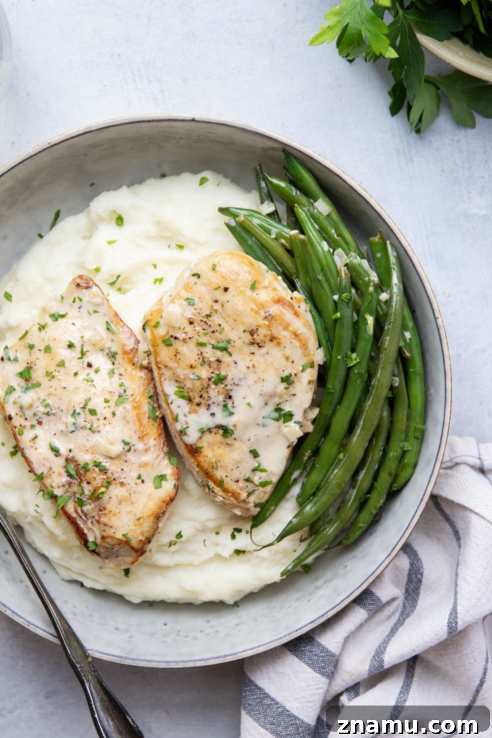 Velvety White Wine Chicken 4 Ingredients for Creamy White Wine Chicken laid out: chicken, green beans, shallots, garlic, butter, olive oil, white wine, cream, flour, broth, parsley.